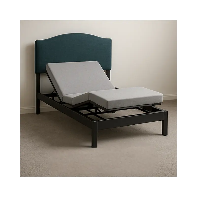 Adjustable bed with gray mattress and navy headboard in a room.