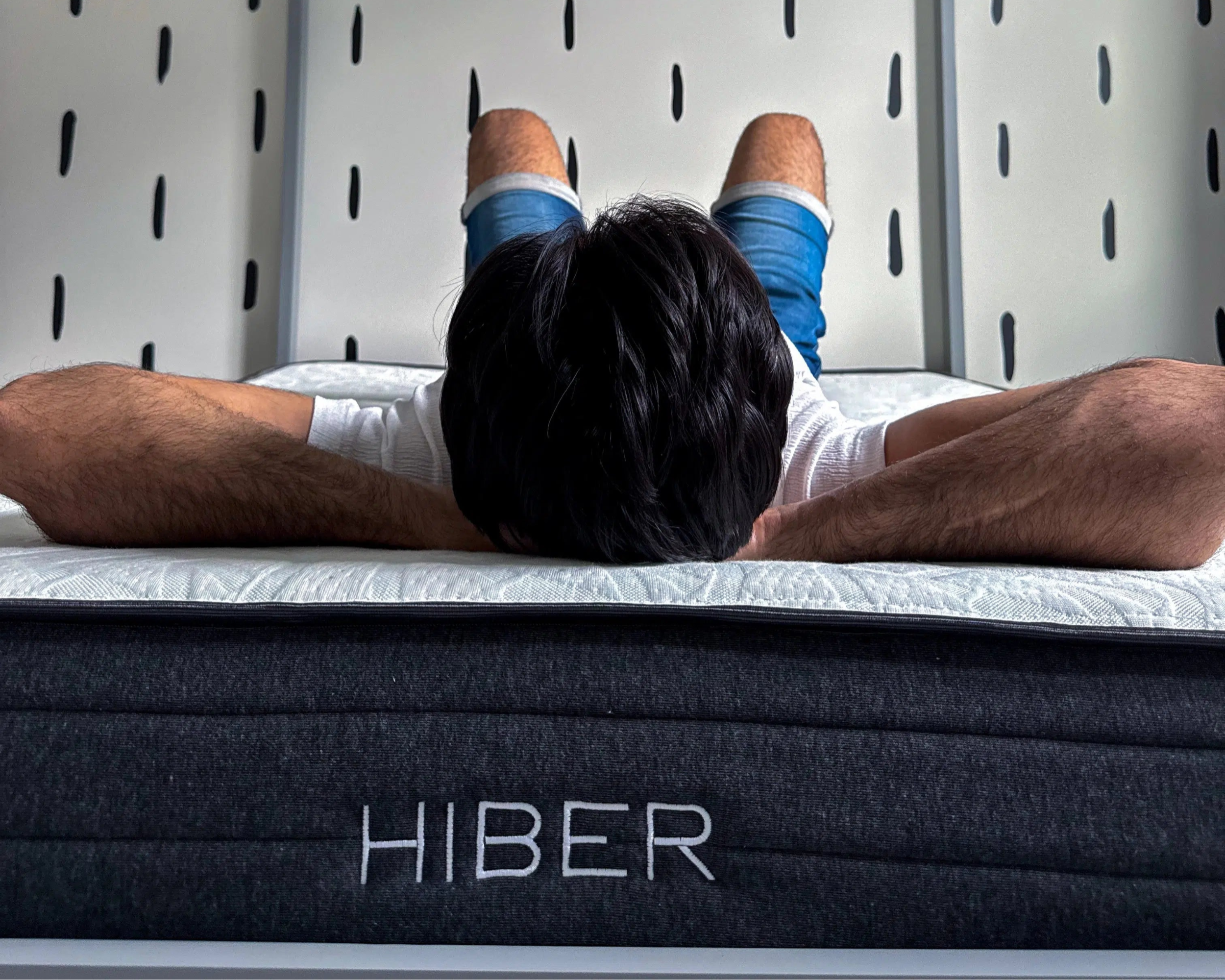 Man laying on HIBER mattress.