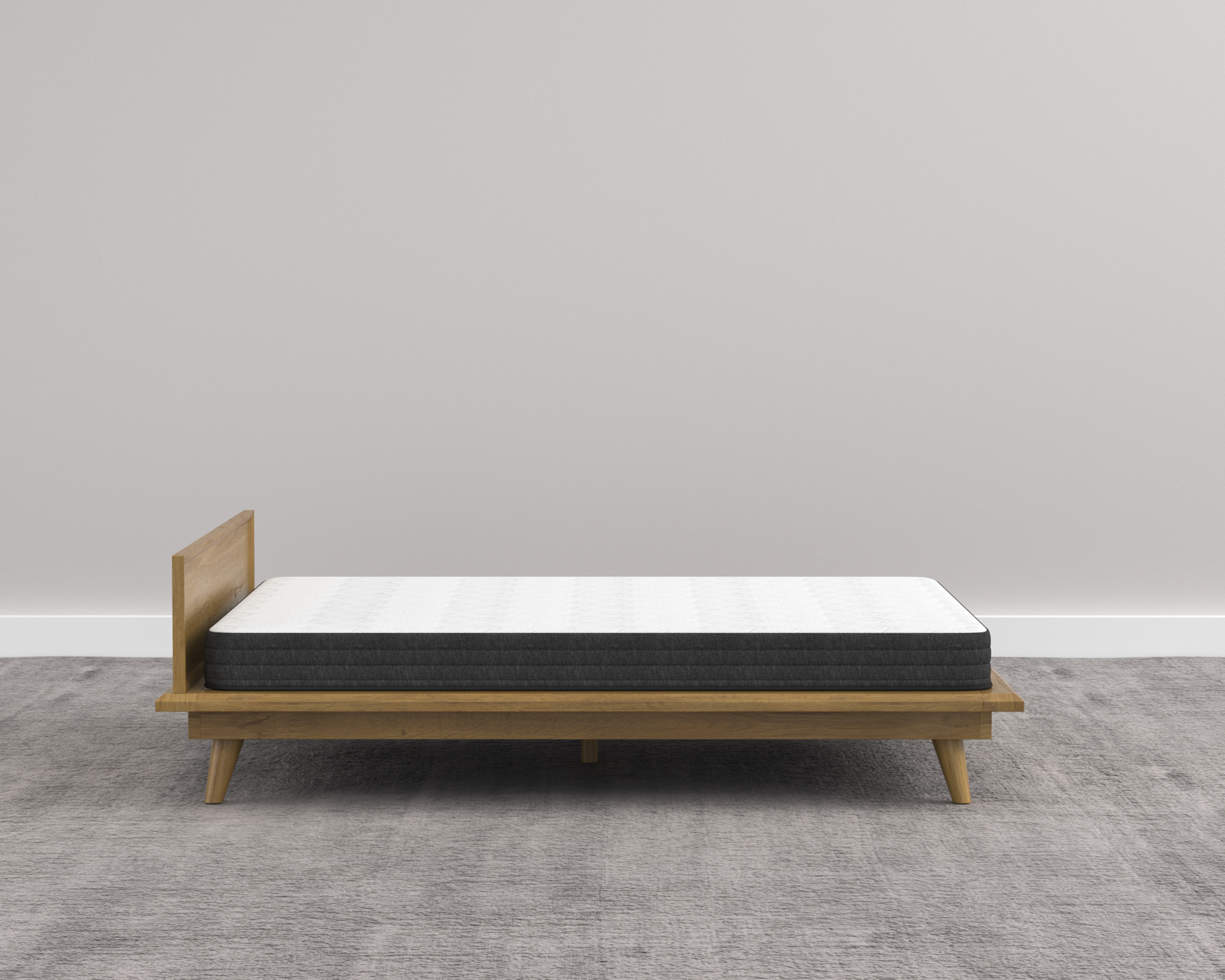 Wooden bed frame with mattress on a gray floor and wall
