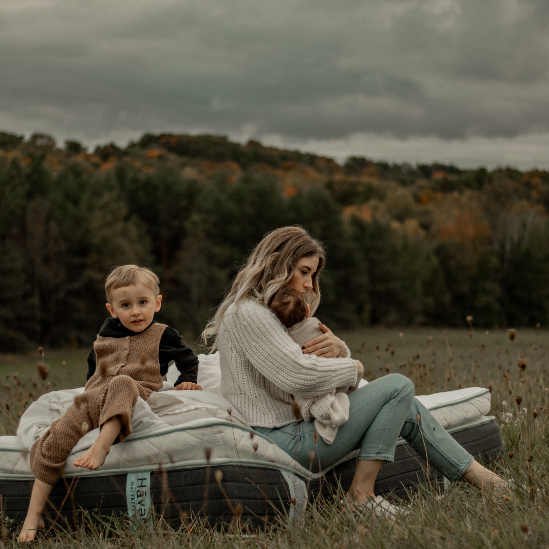 Haven Mattress and Sheets with a woman and two kids