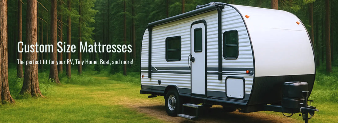 White travel trailer parked in a forest with text promoting custom size mattresses for RVs, vans, boats, and campers.