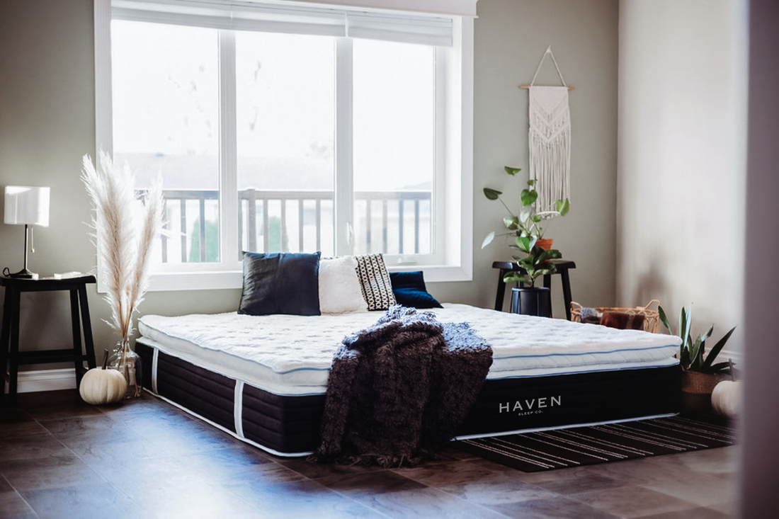 Boho-inspired dream bedroom featuring a luxury Canadian-made Haven mattress, styled with cozy throws, textured pillows, and natural accents for a discerning interior design aesthetic.