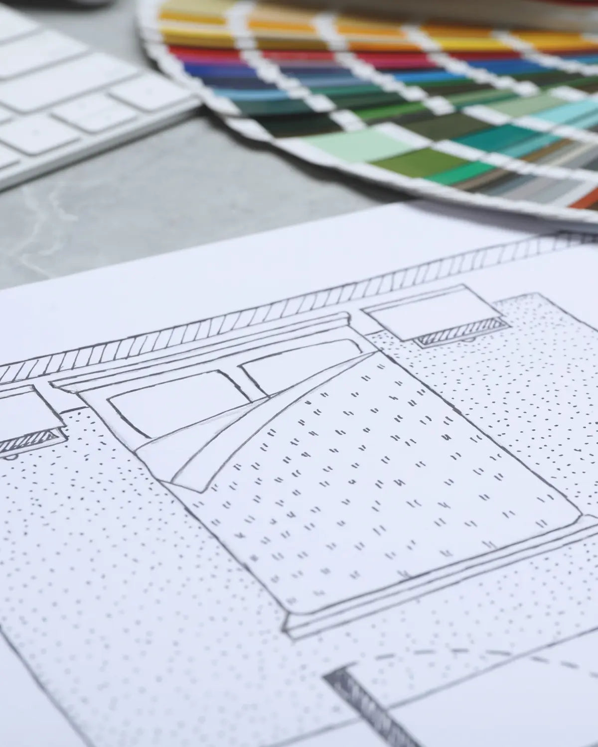 Design sketch on paper with color swatch in the background