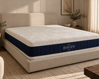 Contour mattress on an upholstered bed frame, angled view