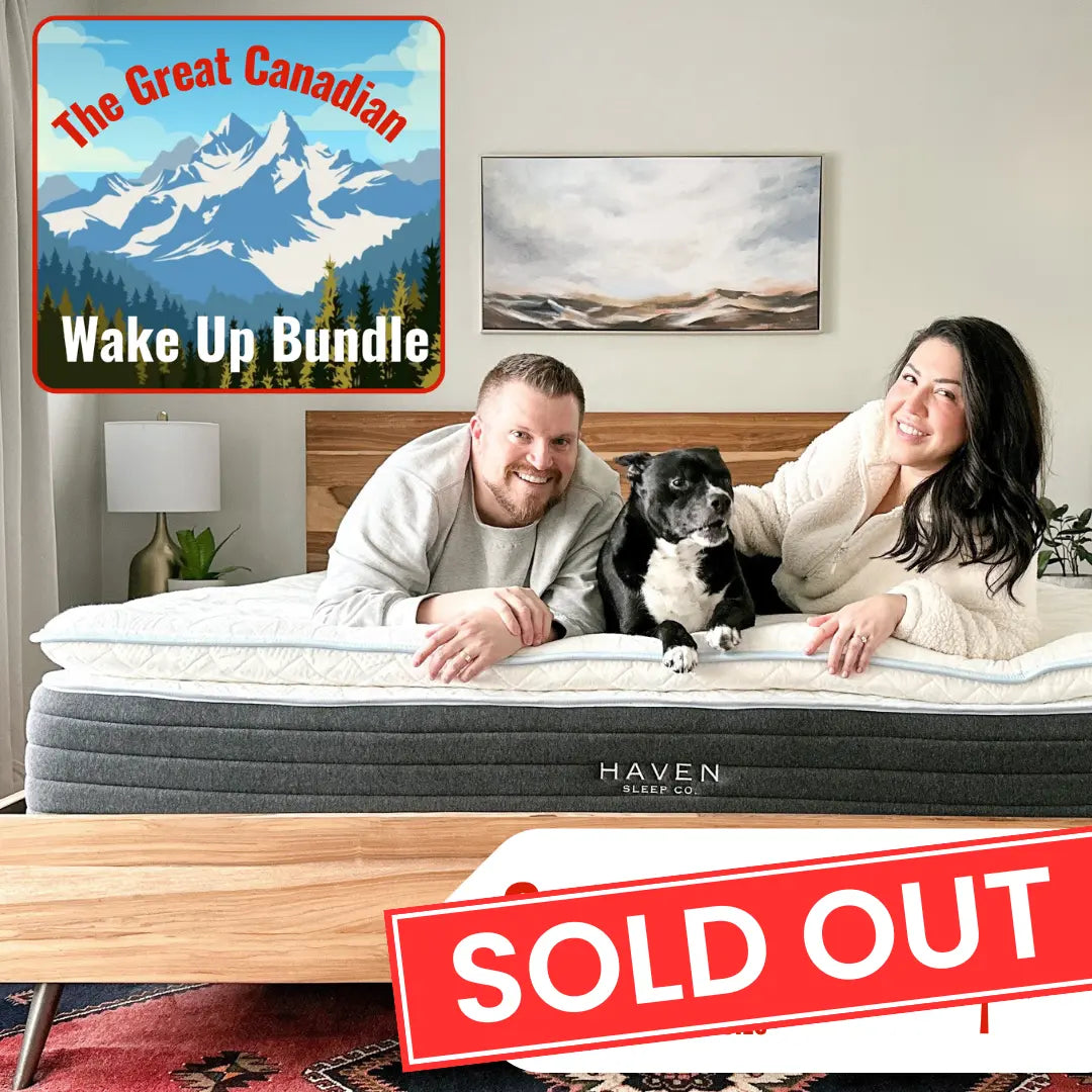 Couple with a dog on a Haven mattress, featuring 'The Great Canadian Wake Up Bundle' and a 'SOLD OUT' sign.