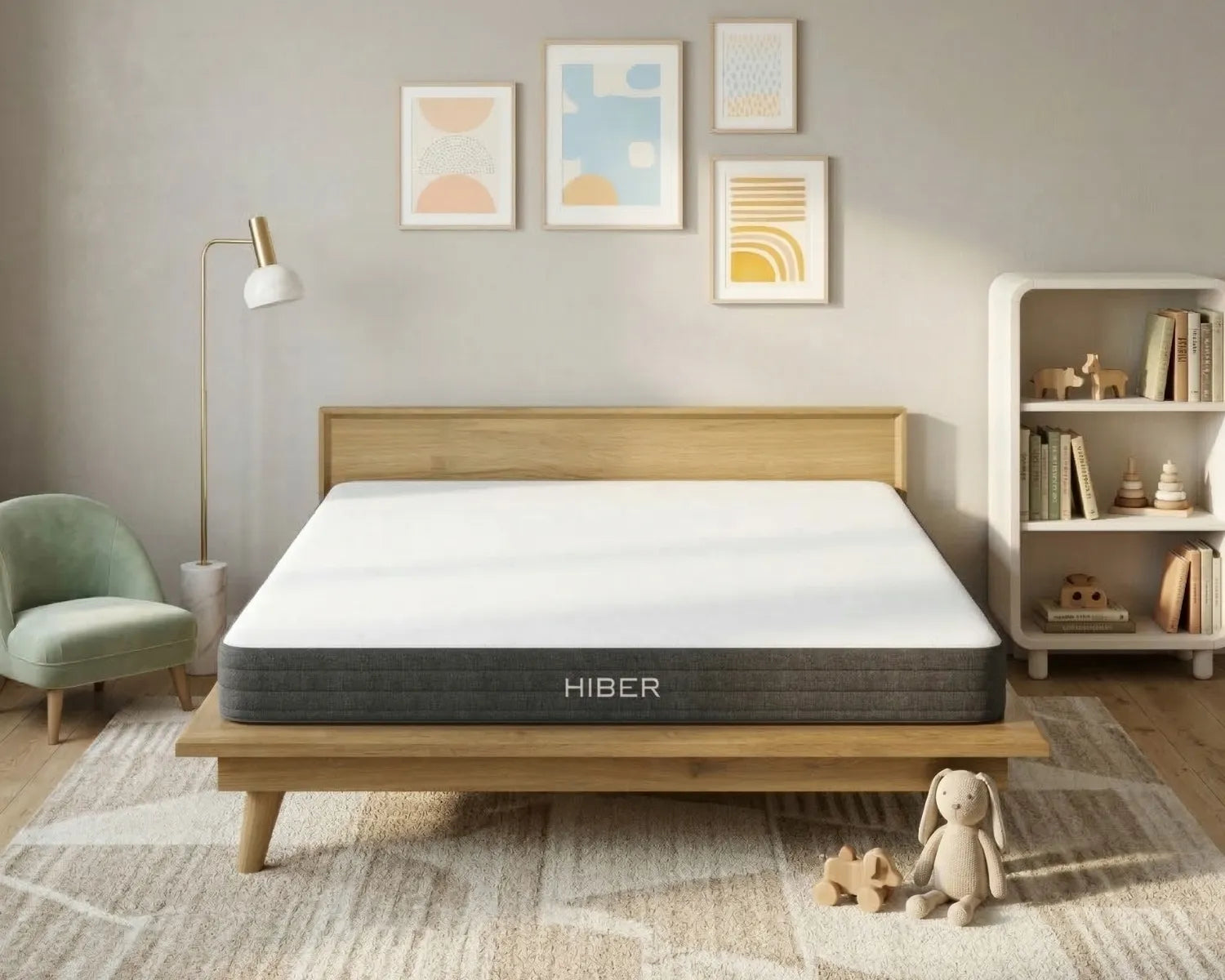 Hiber mattress on a wooden bed frame in a bedroom setting with decor elements.