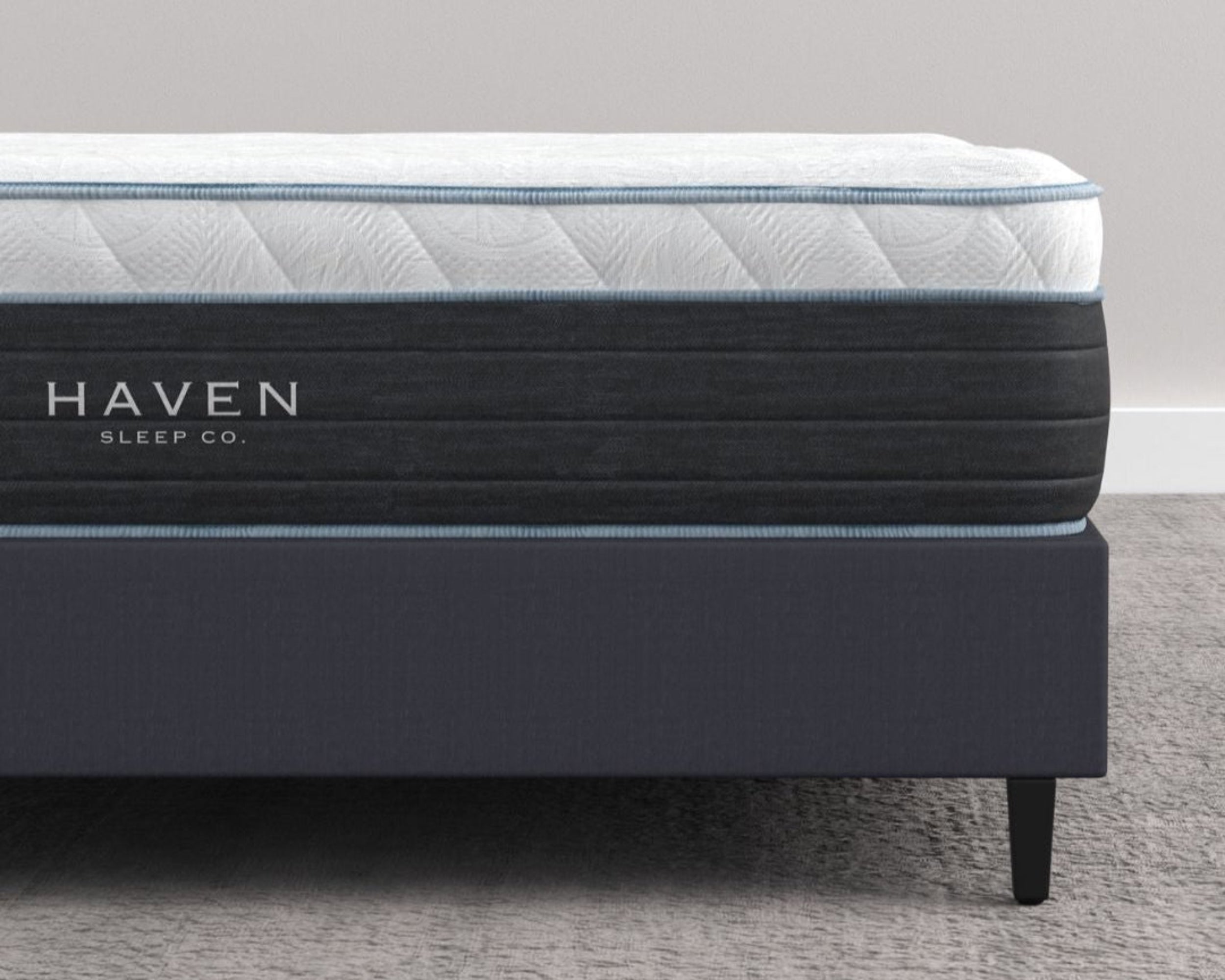 Side View of Haven Hybrid Mattress on a Bed Frame in a Modern Bedroom