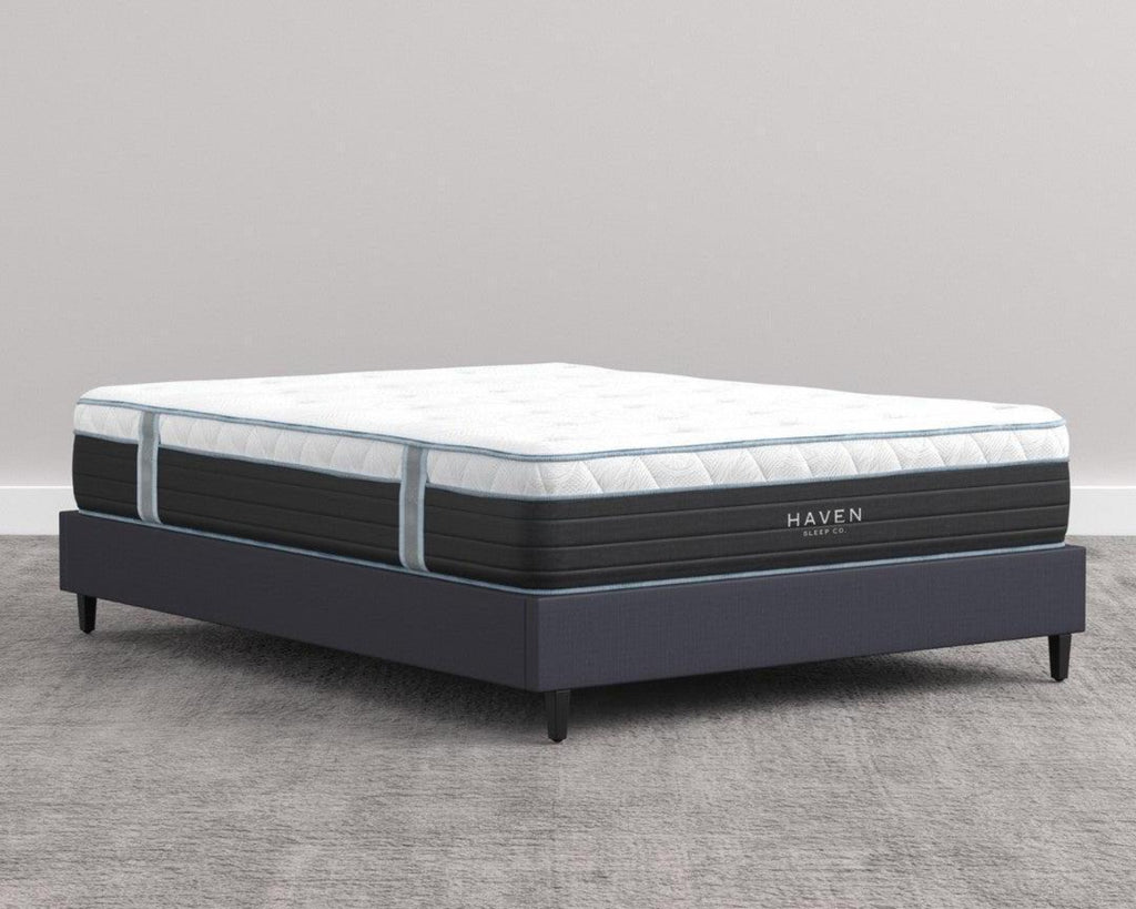 Angled View of Haven Hybrid Mattress on a Low Bed Frame in a Minimalist Bedroom