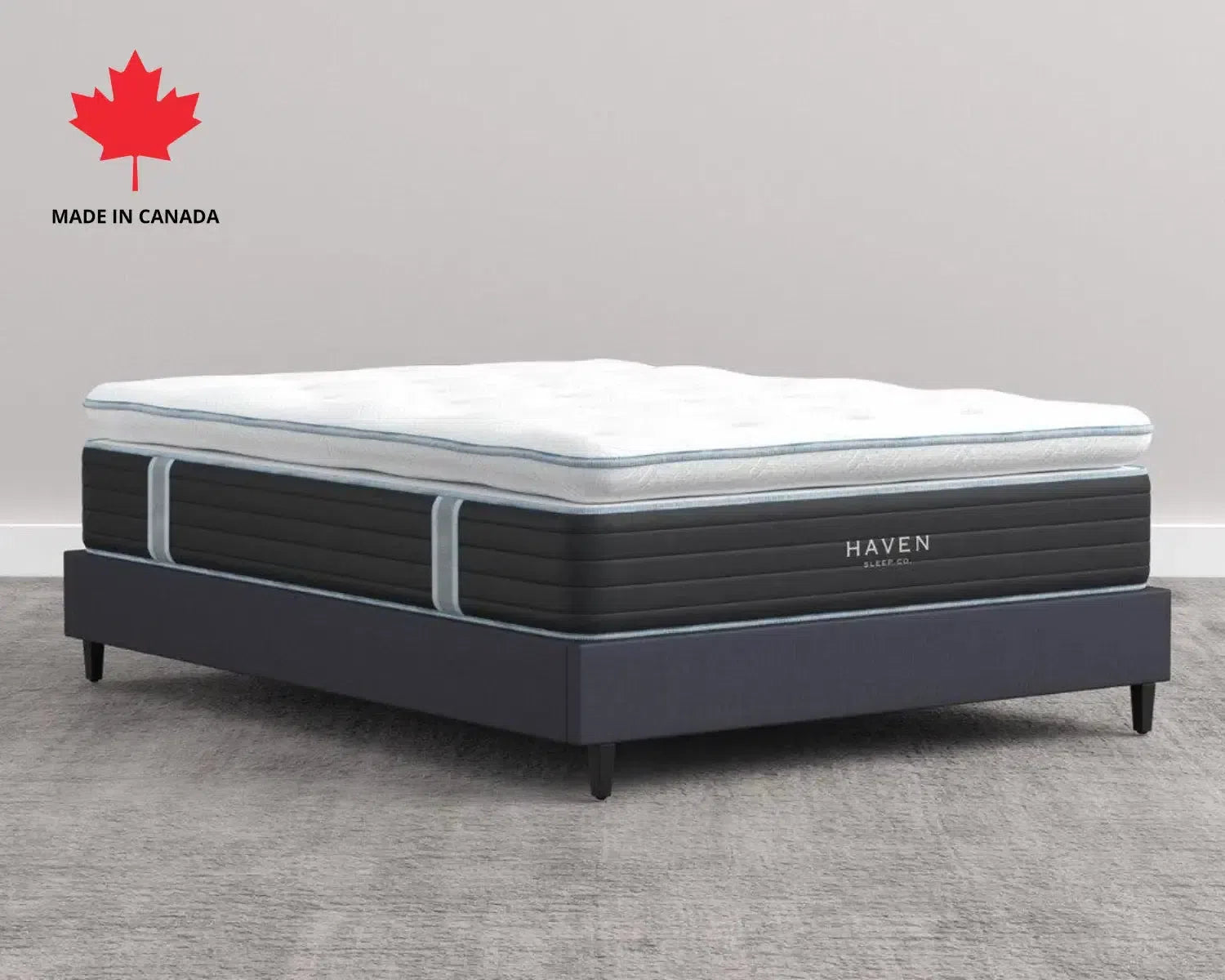 Haven LUX Pillowtop Hybrid Mattress with plush top and supportive base, made in Canada, displayed on a platform bed frame in a modern bedroom