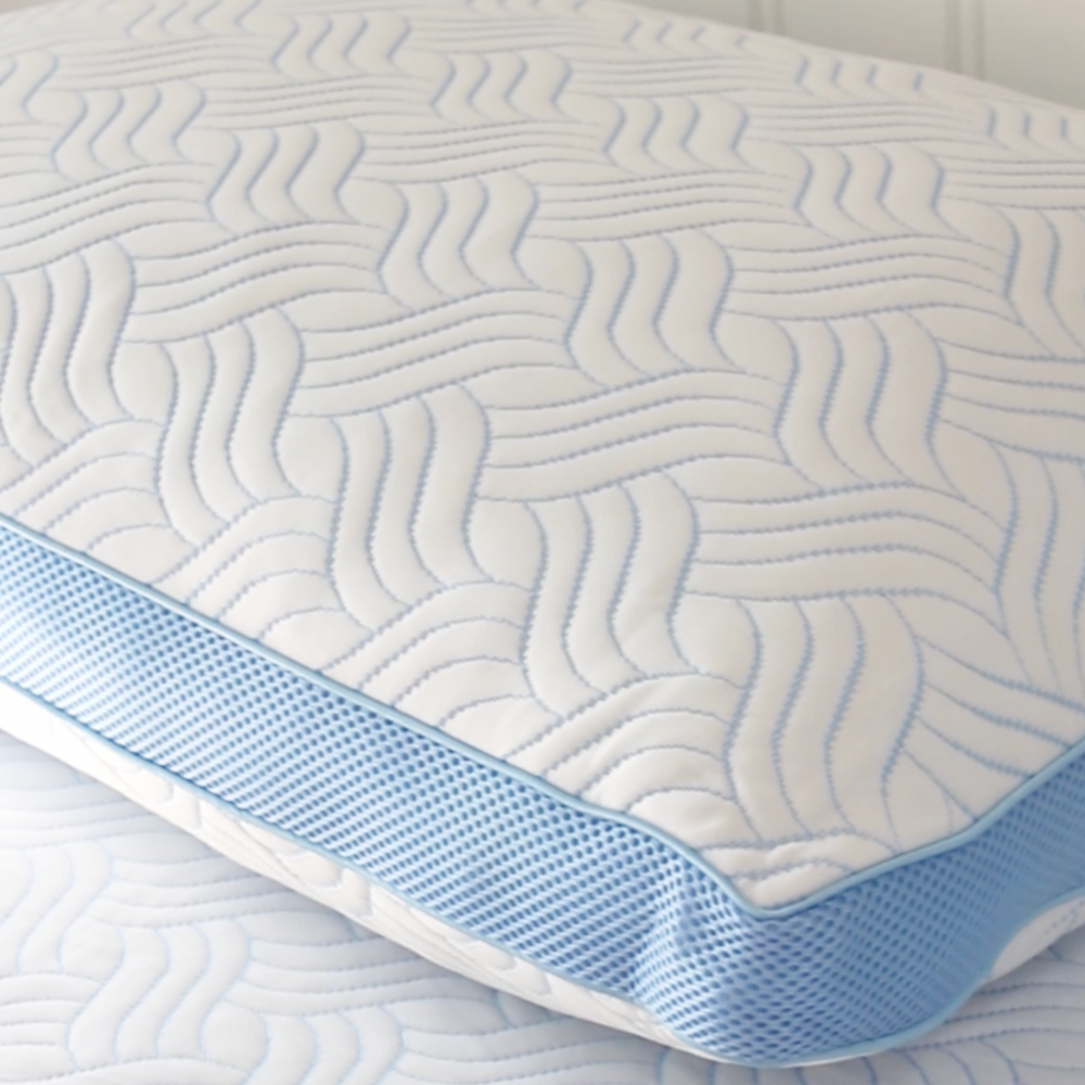 Haven's Cool Ice Adjustable Fill Pillow with a cooling wave pattern and blue mesh trim, designed for optimal temperature regulation and customized support.