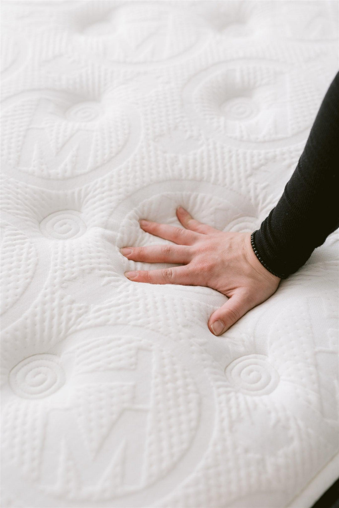 Hand pressing Haven pocket coil mattress
