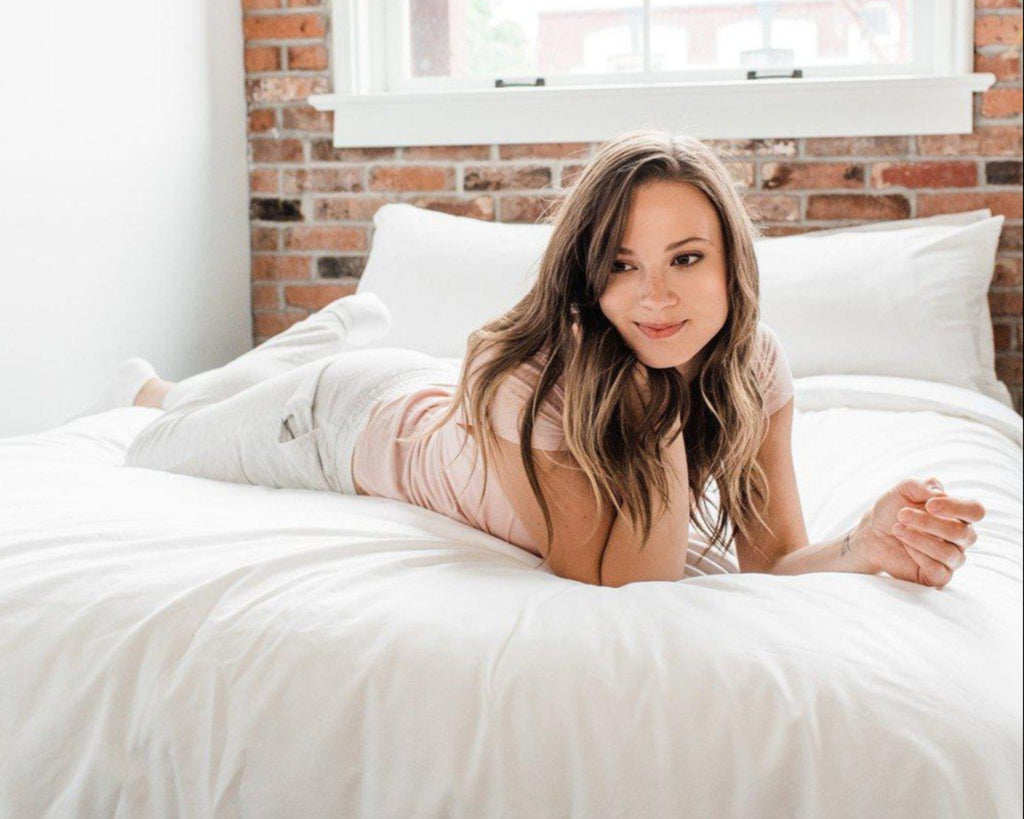 brunette woman on bedface premium duvet cover